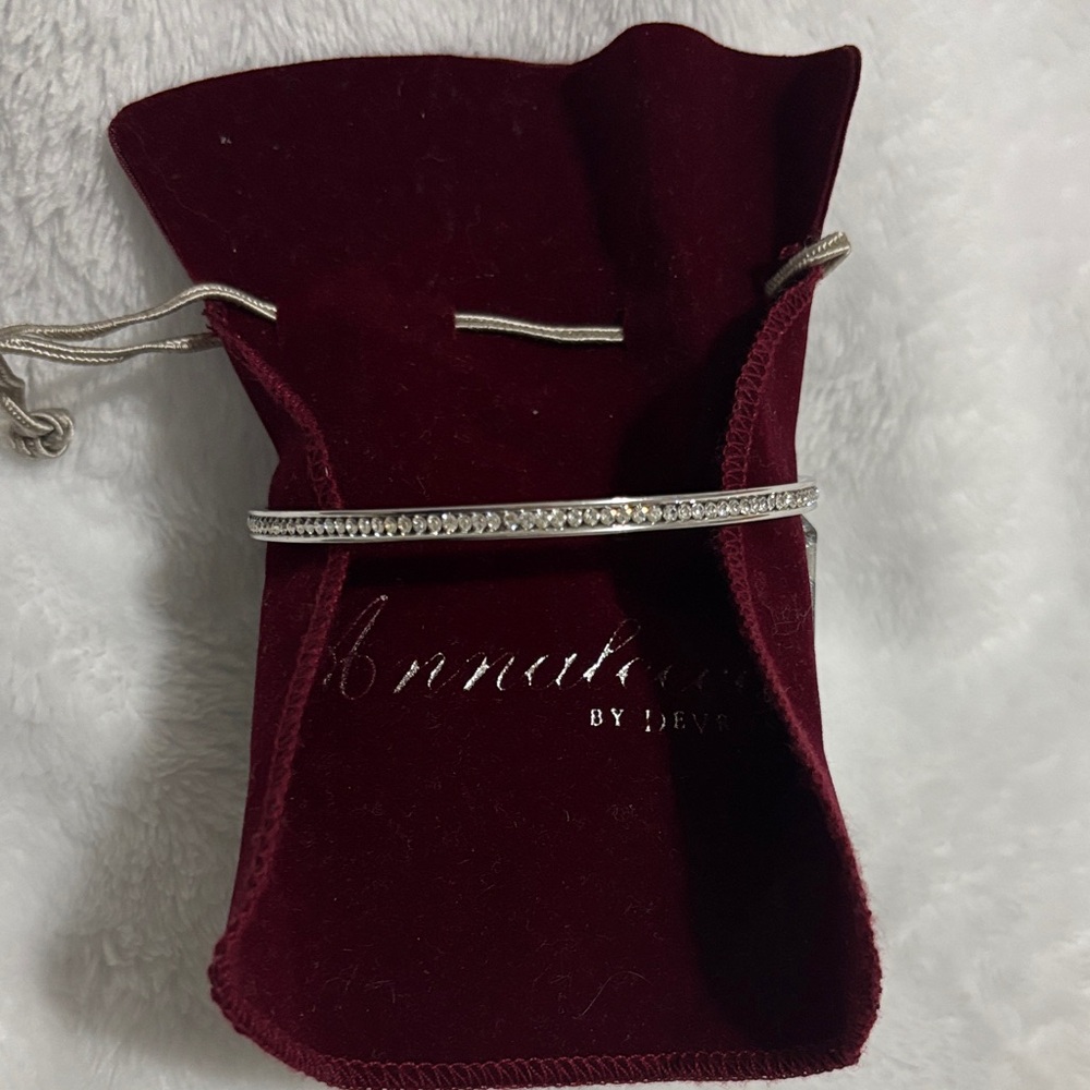 Silver tone diamond like bangle